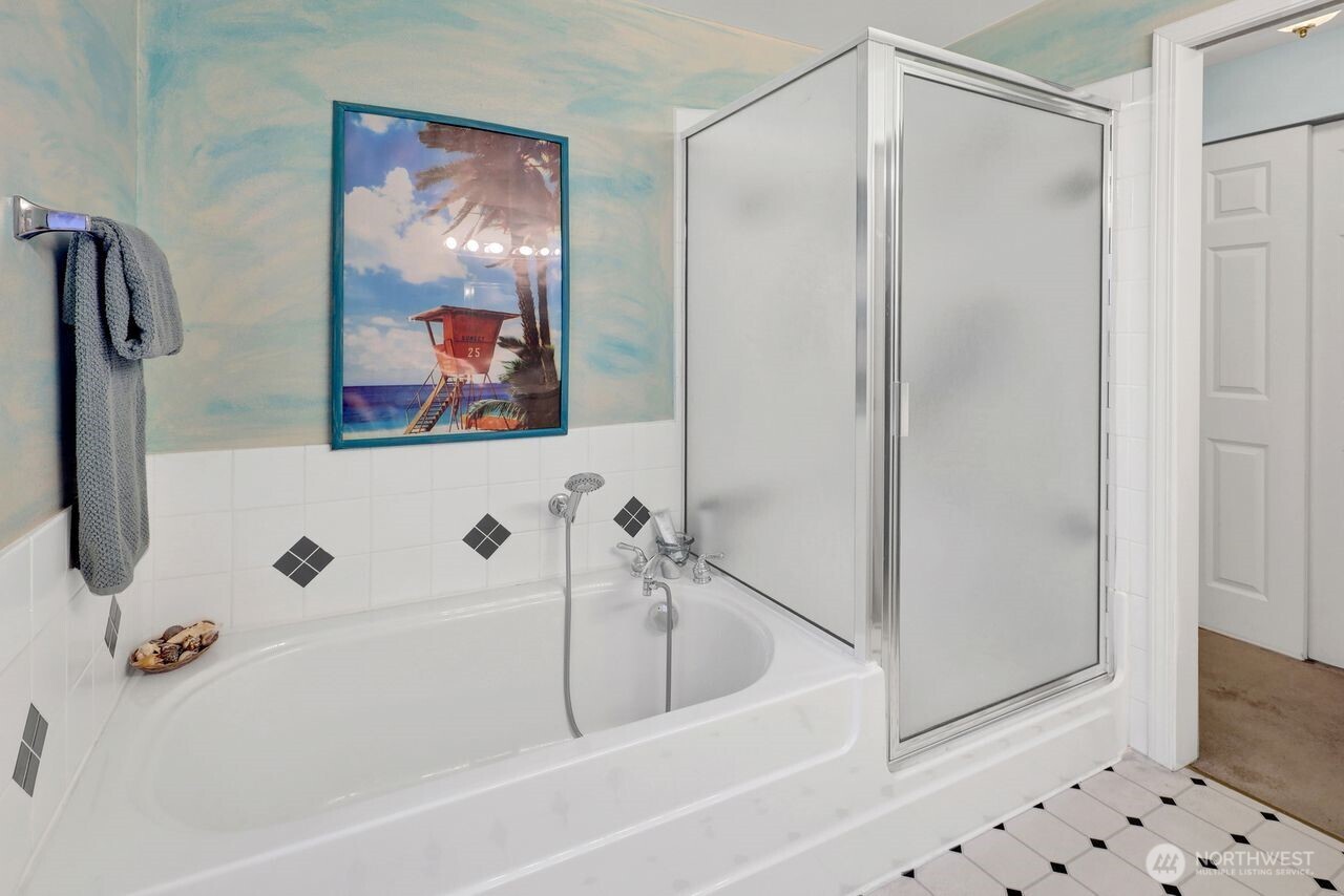 840 Nevada Street Bellingham, WA 98229 - Photo 29 of 38 a bathroom with a bathtub and a shower