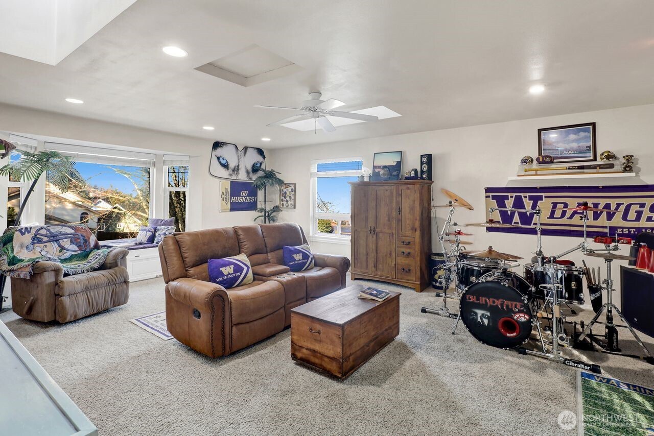 840 Nevada Street Bellingham, WA 98229 - Photo 30 of 38 a living room with furniture a refrigerator and a window