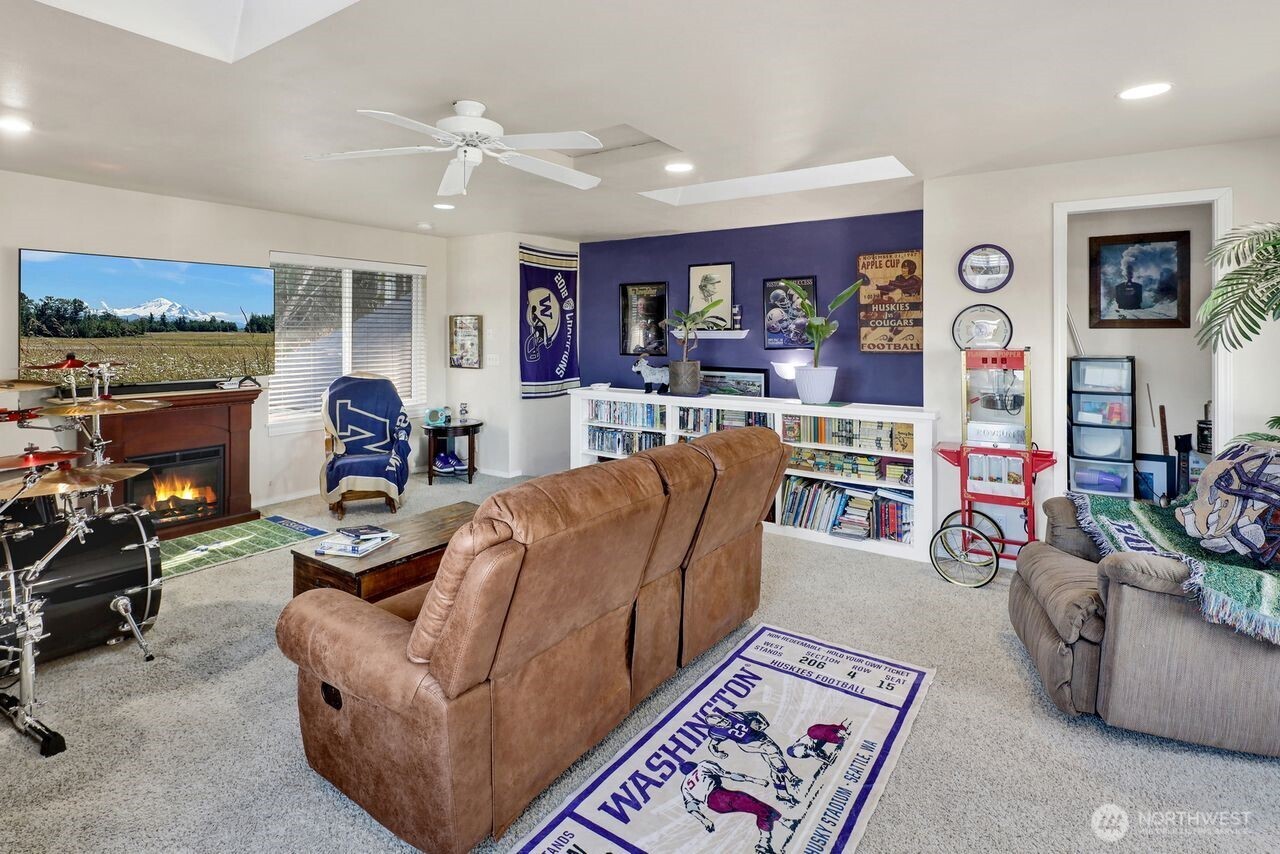 840 Nevada Street Bellingham, WA 98229 - Photo 31 of 38 a living room with furniture and a fireplace