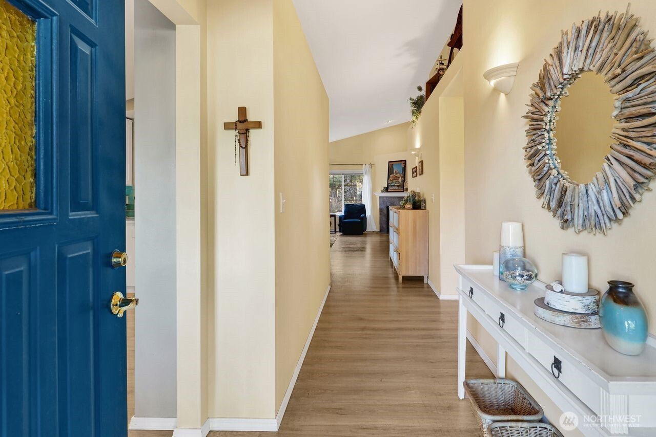 840 Nevada Street Bellingham, WA 98229 - Photo 4 of 38 a hallway with a sink and a wooden floor