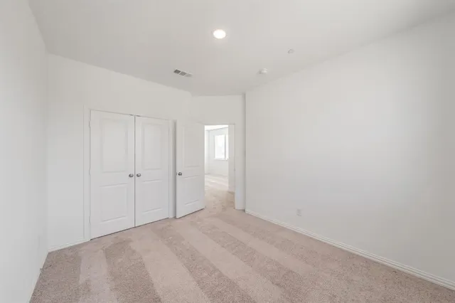a bathroom with a sink a mirror a vanity and shower