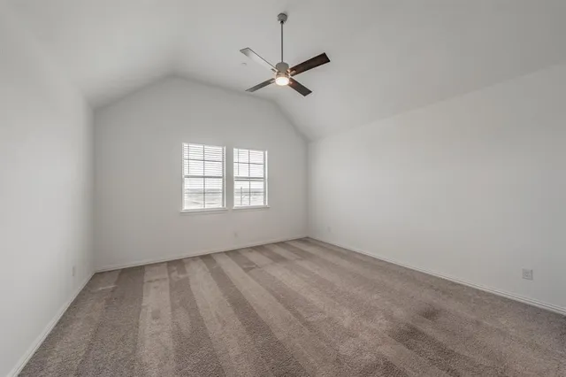 an aerial view of a house with a swimming pool