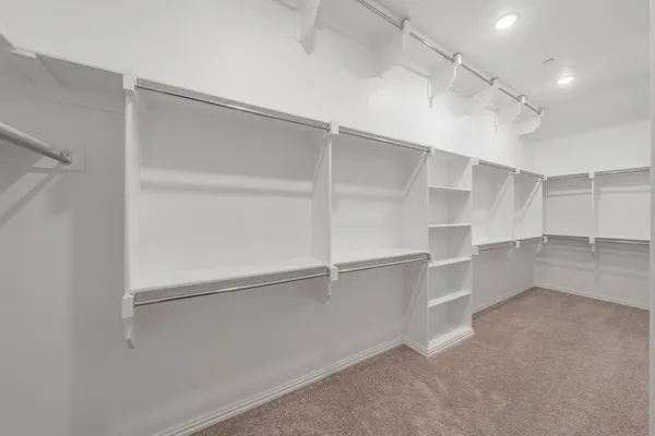 a view of an empty walk in closet