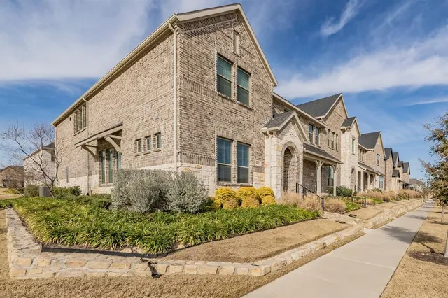 a front view of a residential houses with street