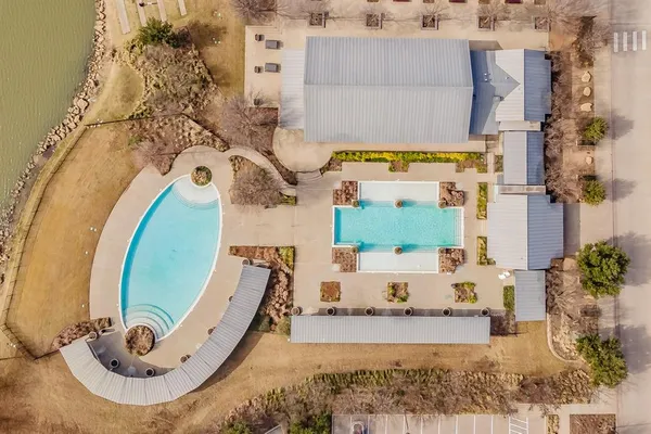 an aerial view of a house with a swimming pool