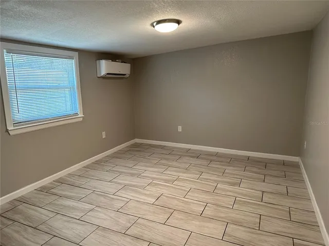 a bathroom with a shower and a glass door