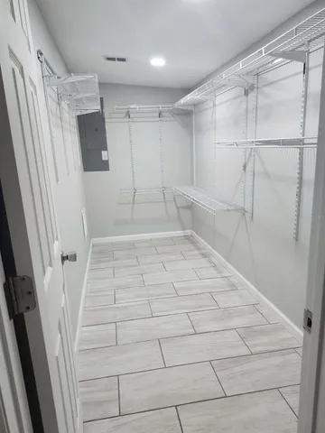 a bathroom with a bathtub and shower