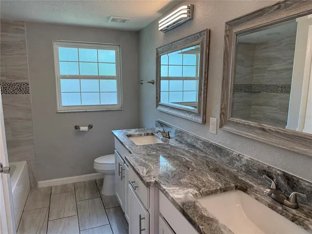 a backyard of a house with lots of green space