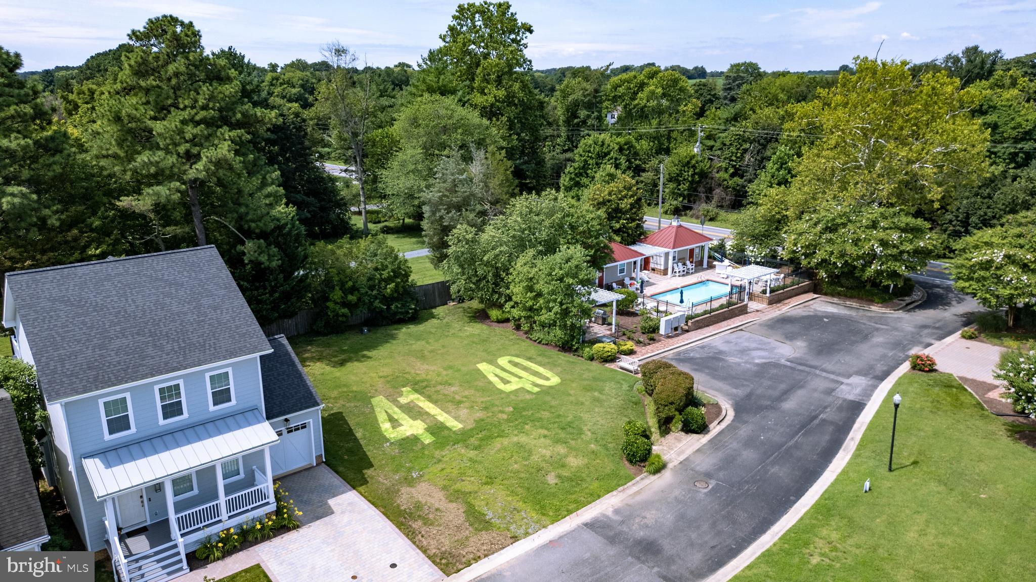 106 Landing Lane Chestertown, MD 21620 - Photo 3 of 24 an aerial view of a house with a garden and large trees