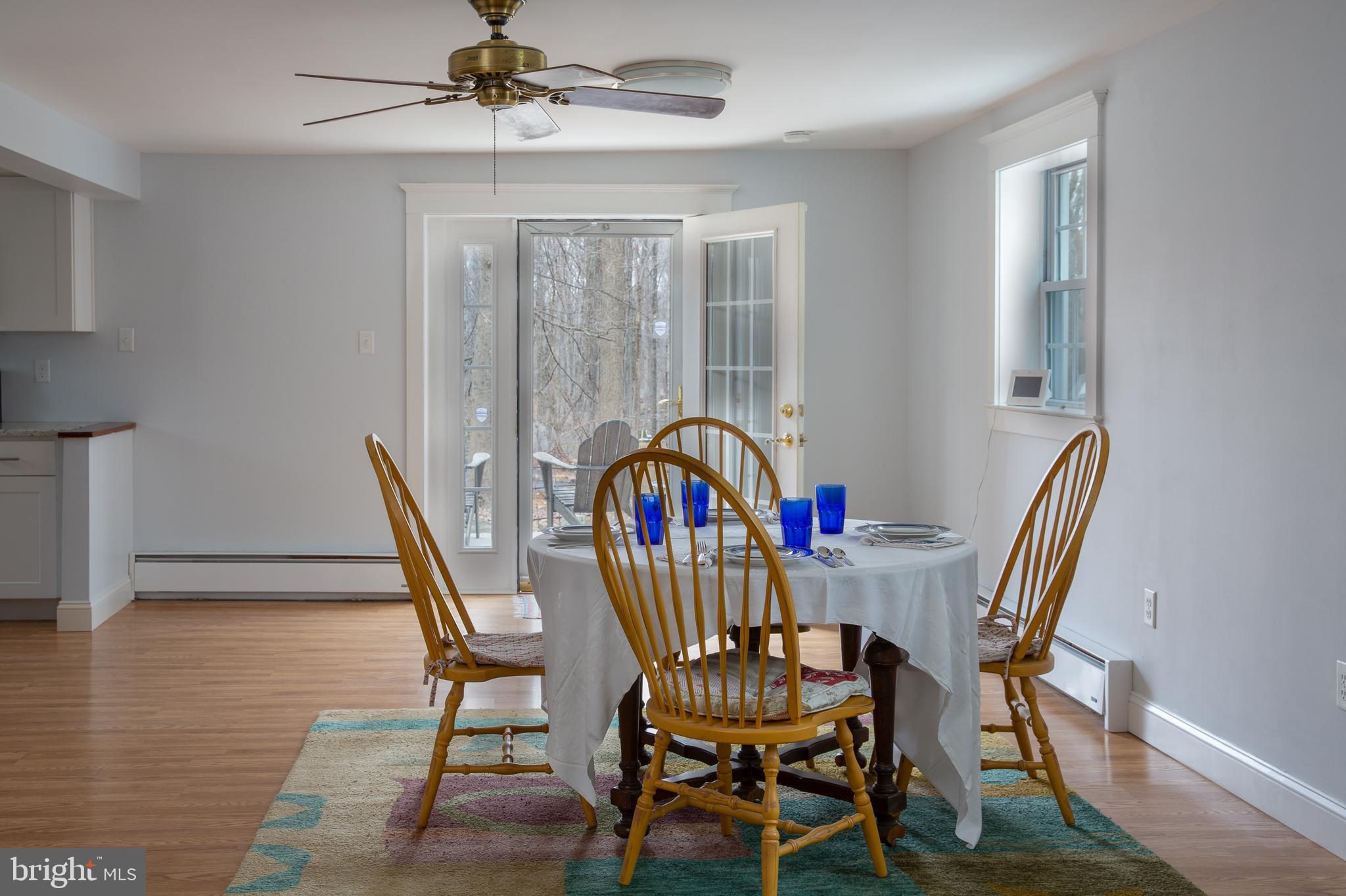 Dining area leading to back patio and grill area