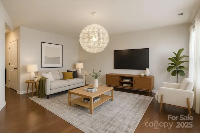 a living room with furniture and a flat screen tv