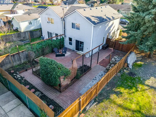 an aerial view of a house with a yard