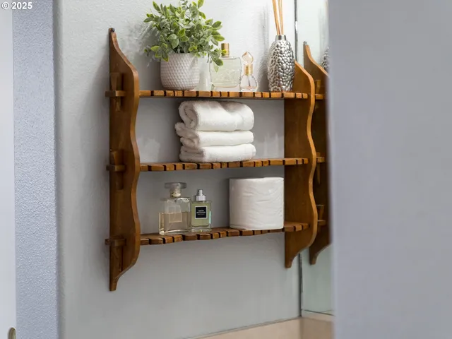 a room with a table and potted plant