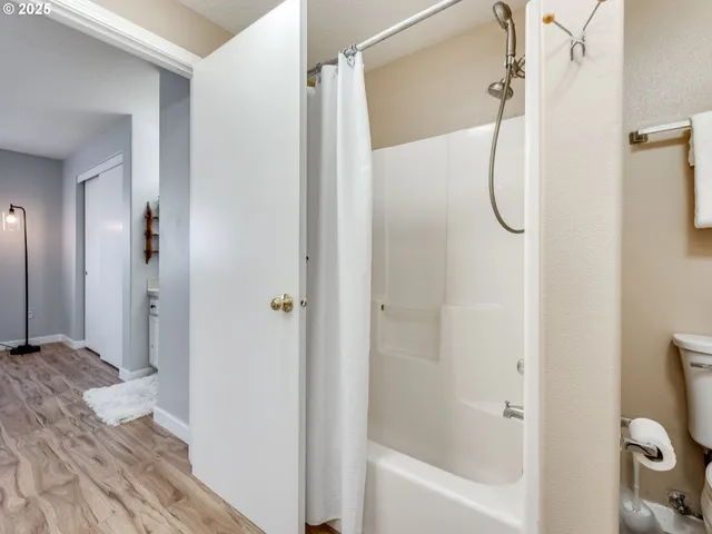 a bathroom with a glass shower door