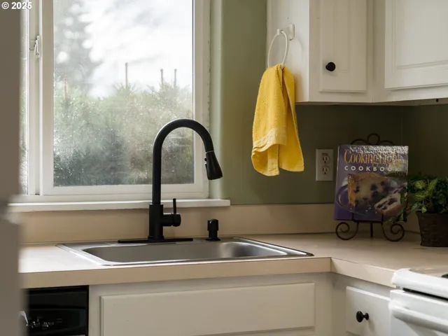 a bathroom with a sink and a window