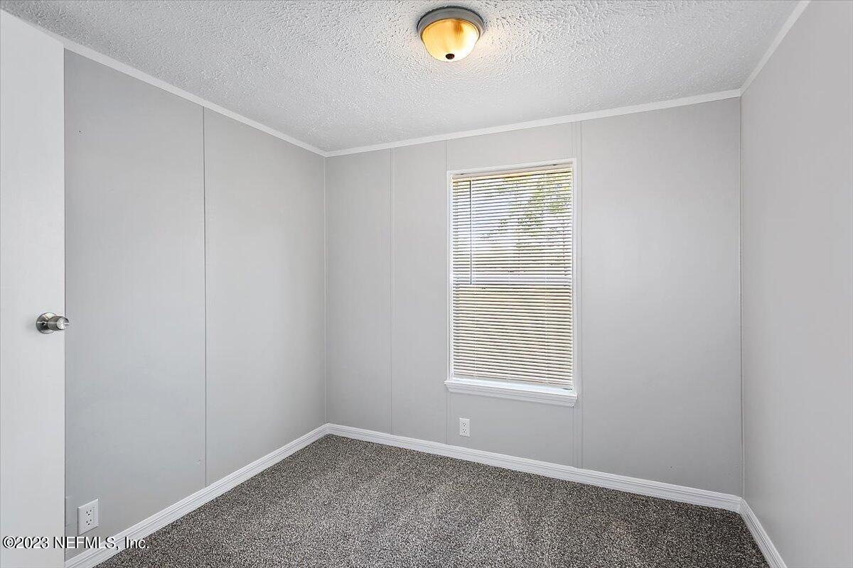 5191 County Road 23B Macclenny, FL 32063 - Photo 7 of 11 a view of an empty room with window