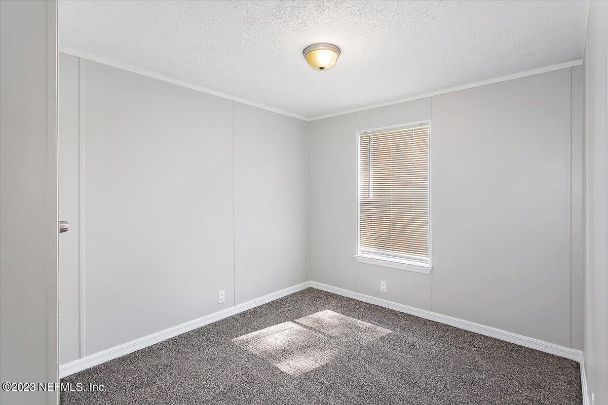 5191 County Road 23B Macclenny, FL 32063 - Photo 9 of 11 an empty room with a window
