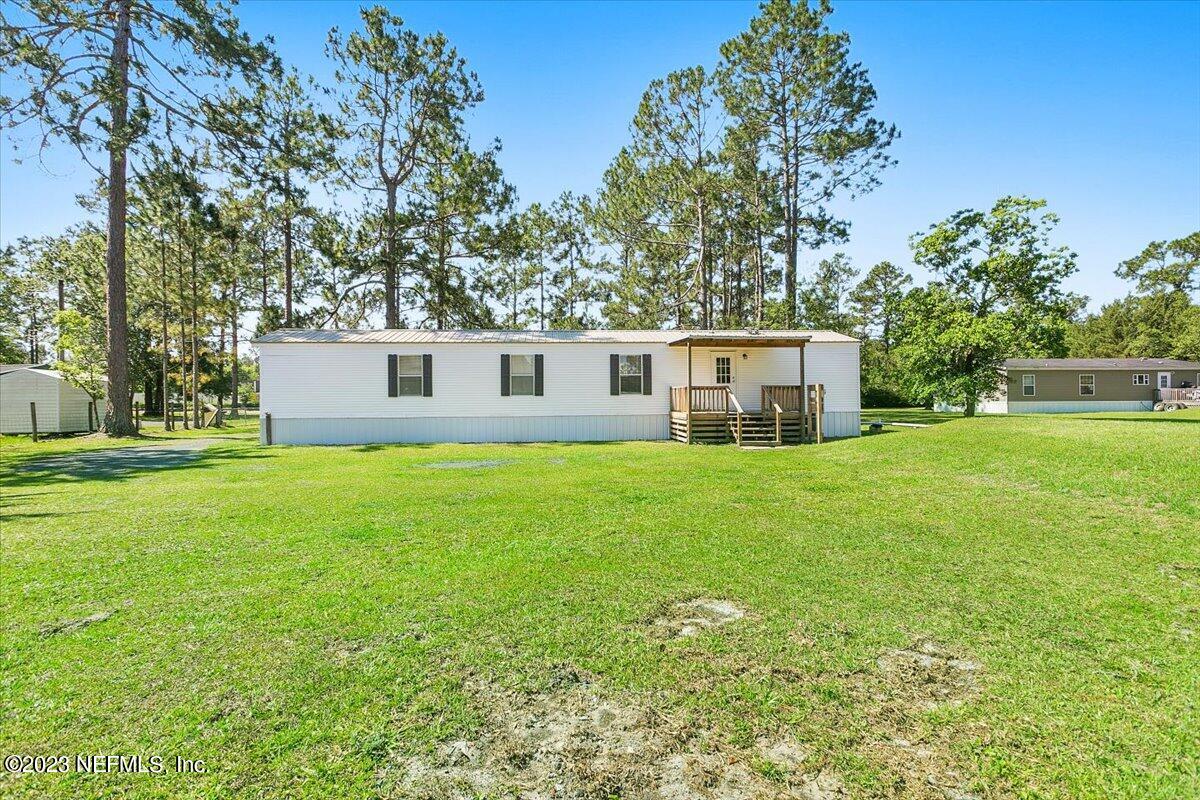5191 County Road 23B Macclenny, FL 32063 - Photo 10 of 11 a front view of house with yard and green space