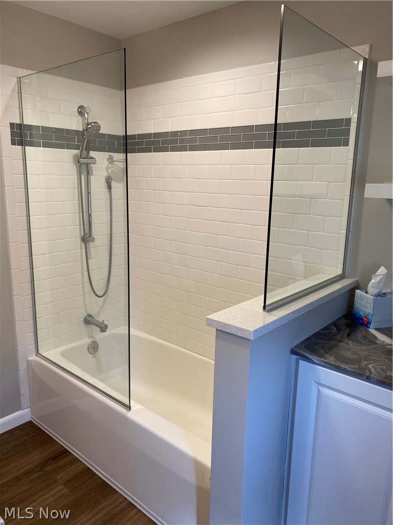14549 Cedar Road Cleveland, OH 44121 - Photo 14 of 23 Upstairs - Bathroom featuring hardwood / wood-style flooring and tiled shower / bath combo