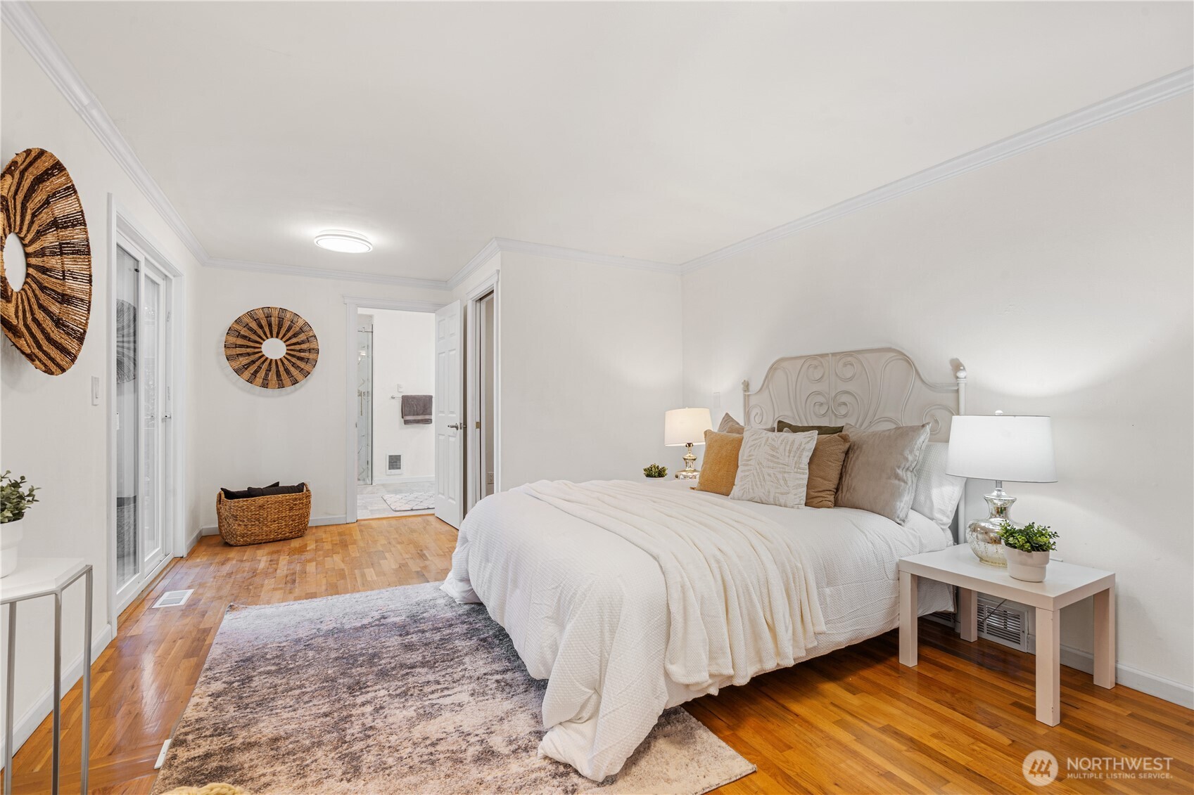 959 Hoquiam Avenue Northeast Renton, WA 98059 - Photo 12 of 30 a bedroom with a bed and wooden floor