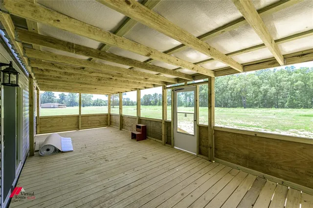 a view of a swimming pool with a porch