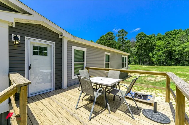 a view of a chairs and table on the deck