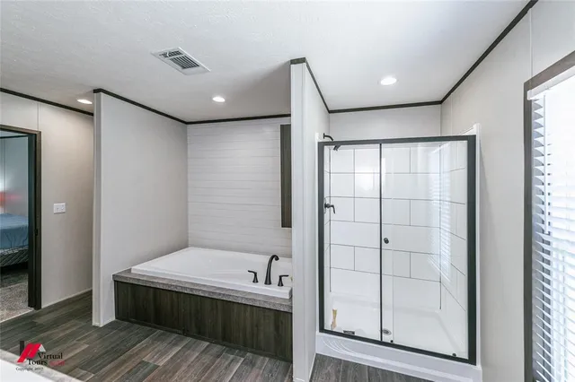 a bathroom with a mirror and a shower