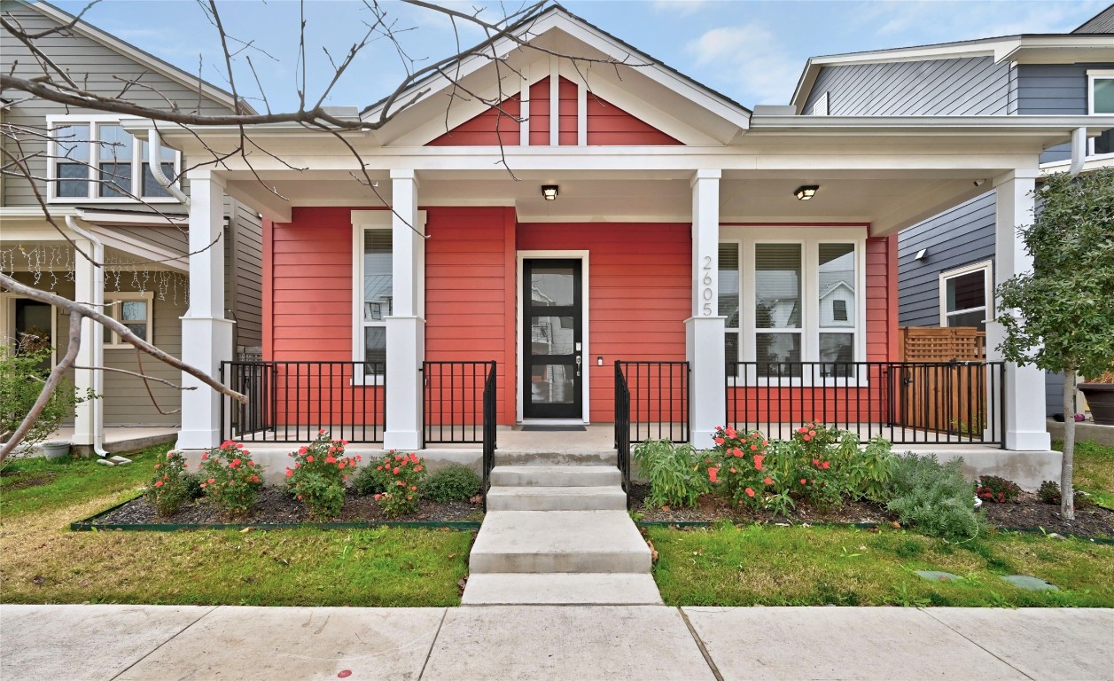a front view of a house with garden