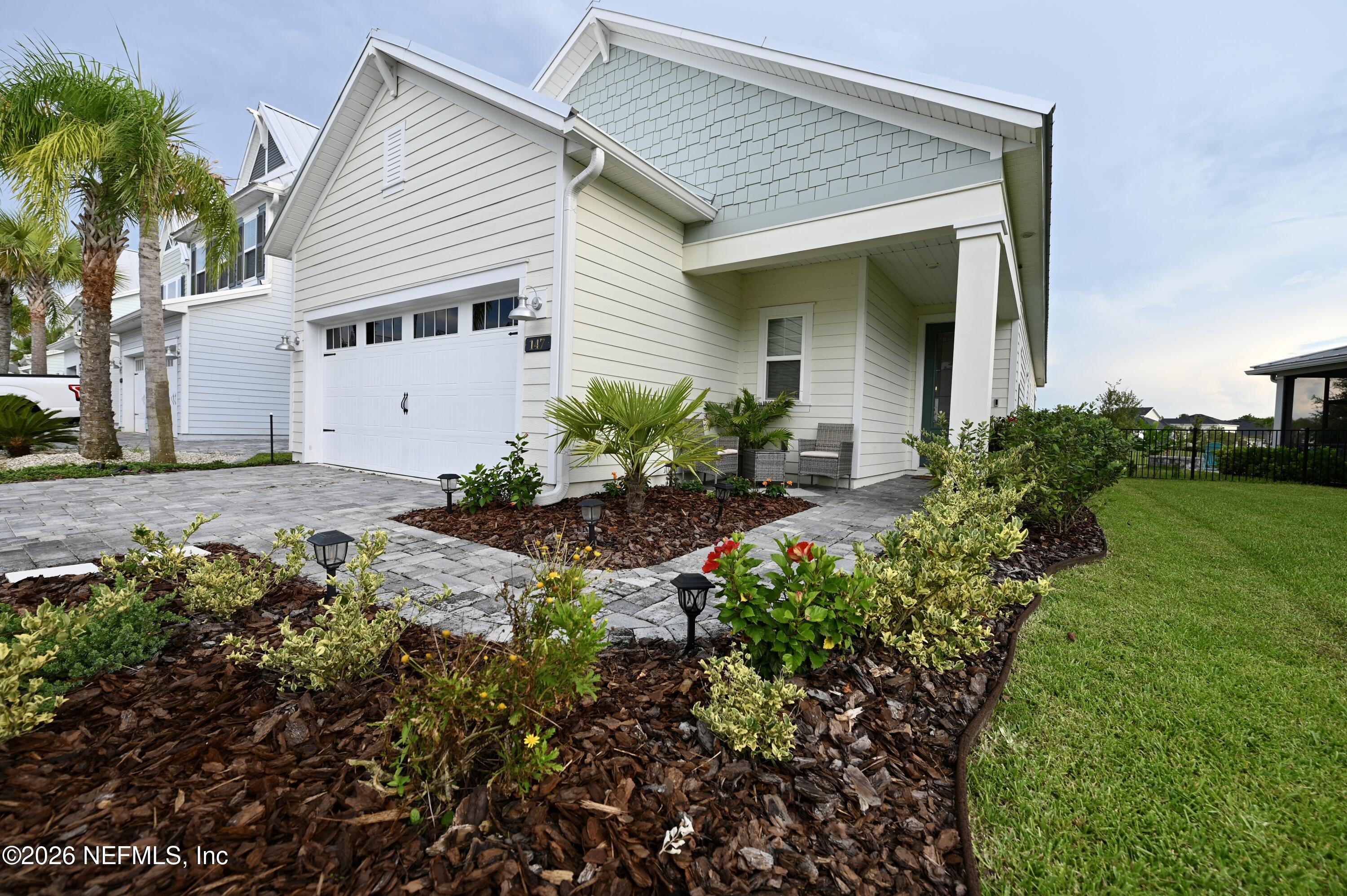147 Clifton Bay Loop St. Johns, FL 32259 - Photo 1 of 34 a front view of a house with a garden
