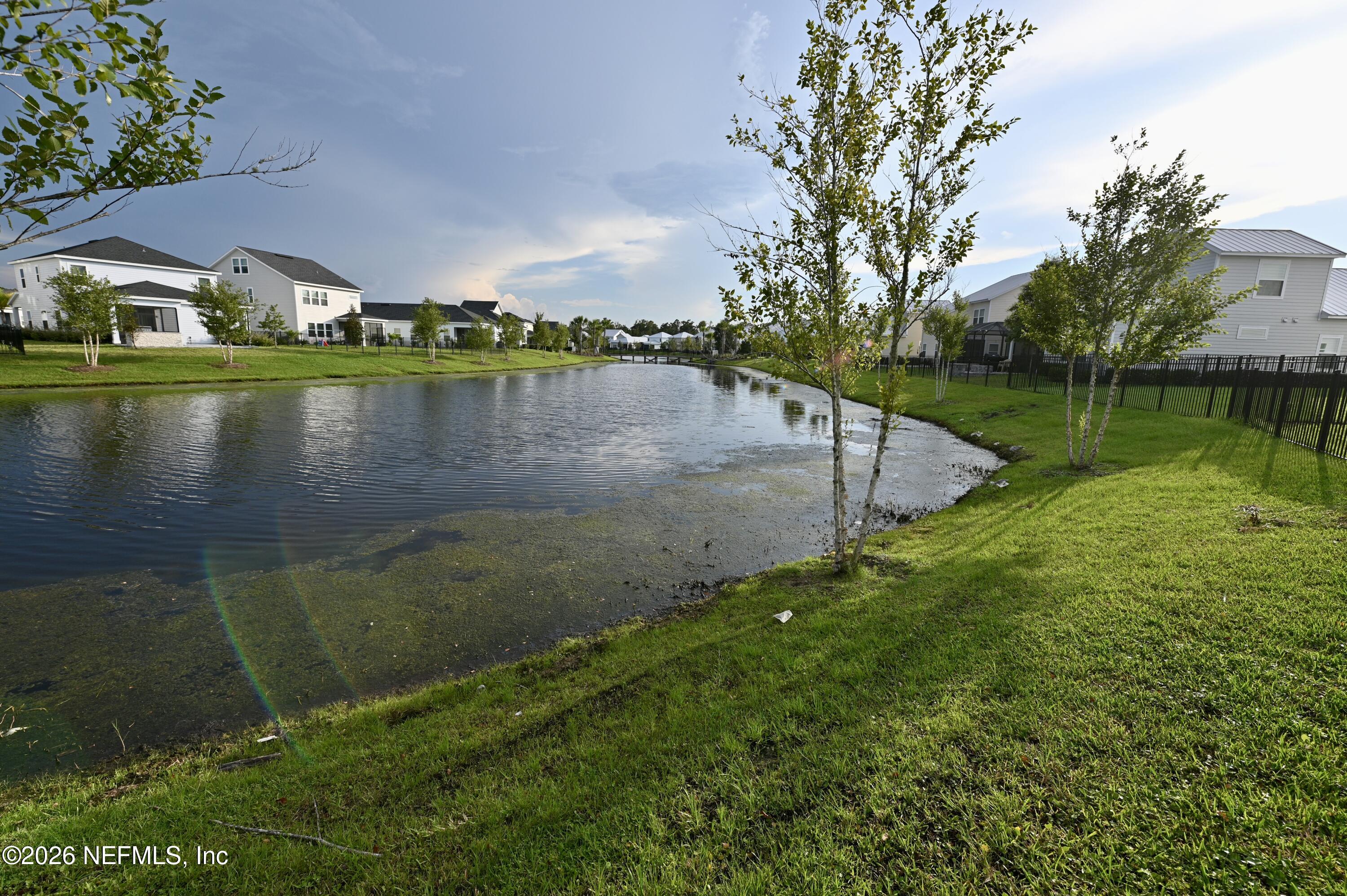 147 Clifton Bay Loop St. Johns, FL 32259 - Photo 10 of 34 a view of a lake with a yard