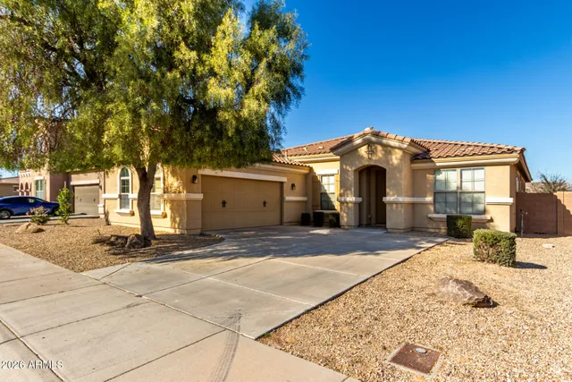 a view of a house with snow on the road