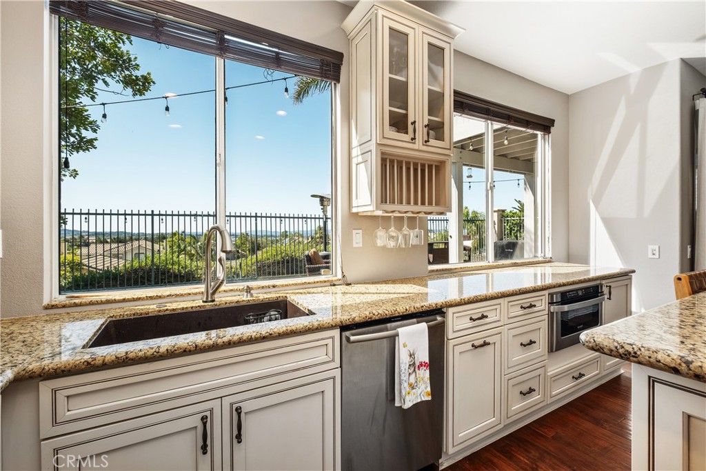22 Sierra Blanco Lake Forest, CA 92610 - Photo 11 of 47 a kitchen with granite countertop a sink and a window