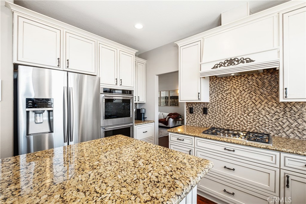 22 Sierra Blanco Lake Forest, CA 92610 - Photo 12 of 47 a kitchen with stainless steel appliances a refrigerator sink and stove