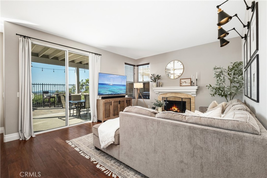 22 Sierra Blanco Lake Forest, CA 92610 - Photo 14 of 47 a living room with furniture a fireplace and a flat screen tv