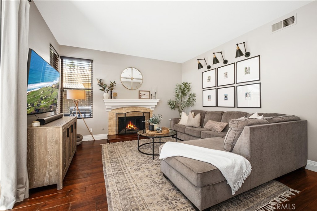 22 Sierra Blanco Lake Forest, CA 92610 - Photo 15 of 47 a living room with furniture a fireplace and a large window
