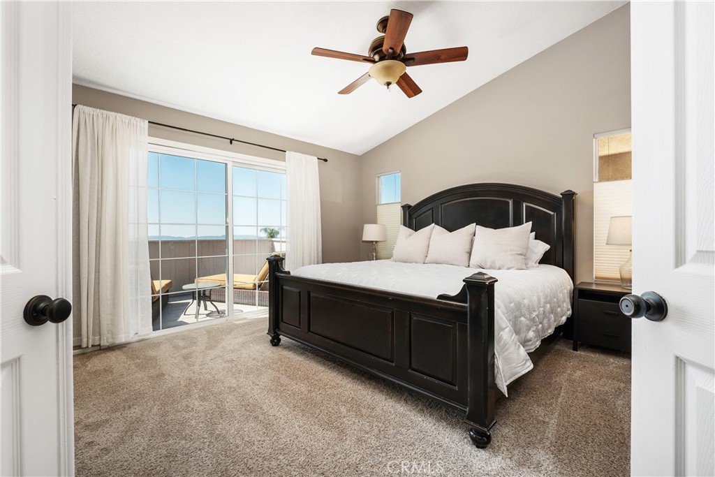 22 Sierra Blanco Lake Forest, CA 92610 - Photo 25 of 47 a bedroom with a large bed and a ceiling fan