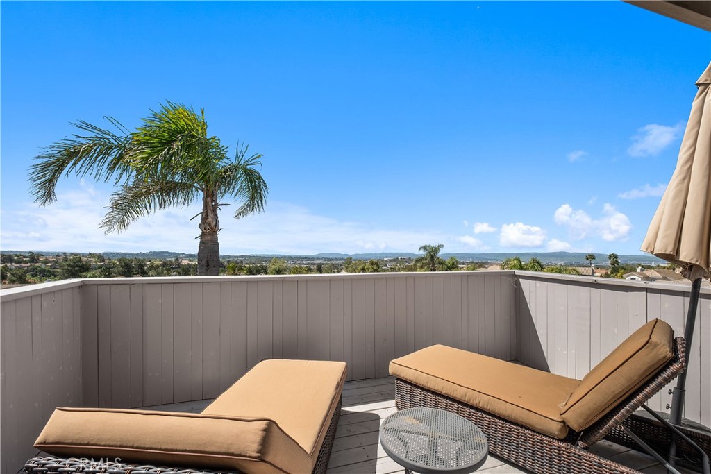 22 Sierra Blanco Lake Forest, CA 92610 - Photo 27 of 47 a view of a balcony with chair and wooden floor