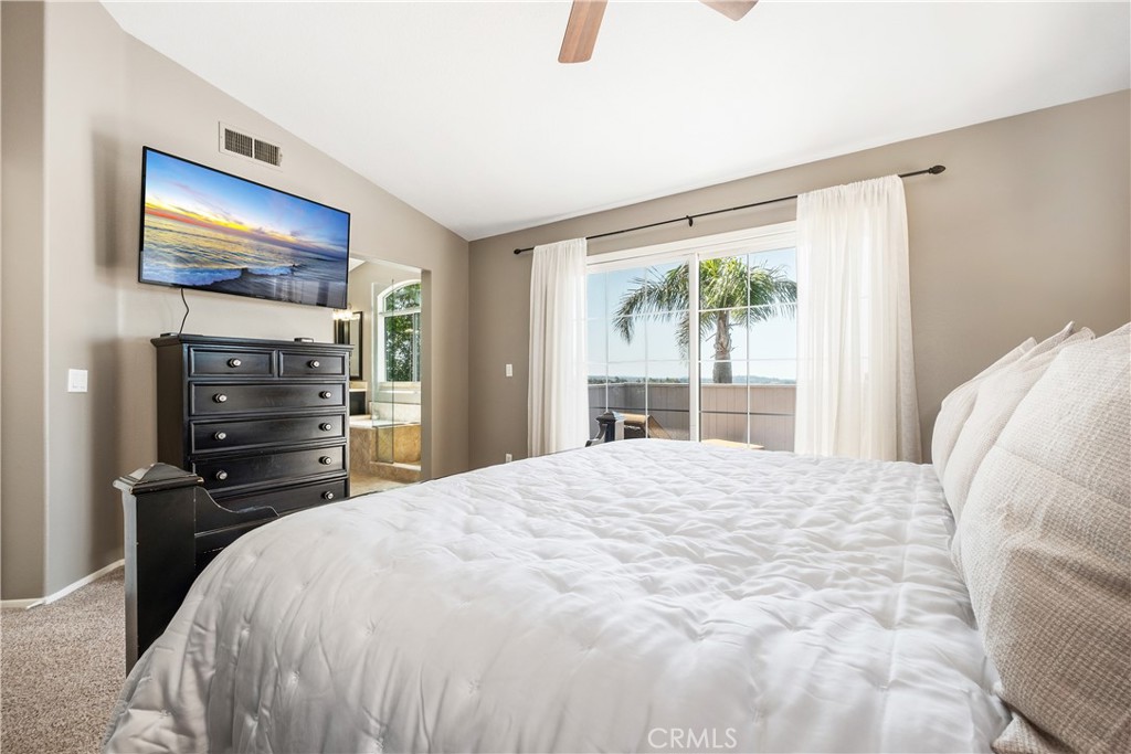 22 Sierra Blanco Lake Forest, CA 92610 - Photo 28 of 47 a bedroom with a bed and a window