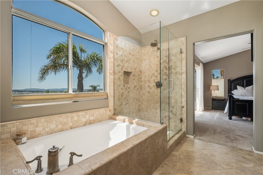 22 Sierra Blanco Lake Forest, CA 92610 - Photo 29 of 47 a bathroom with a tub and a shower
