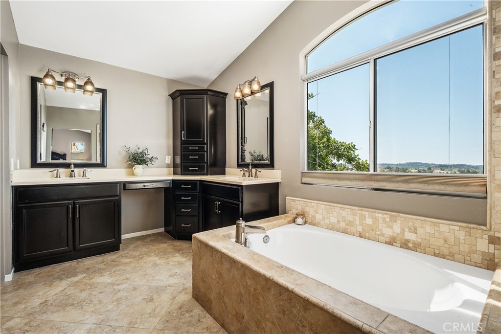 22 Sierra Blanco Lake Forest, CA 92610 - Photo 30 of 47 a spacious bathroom with a tub sink and mirror