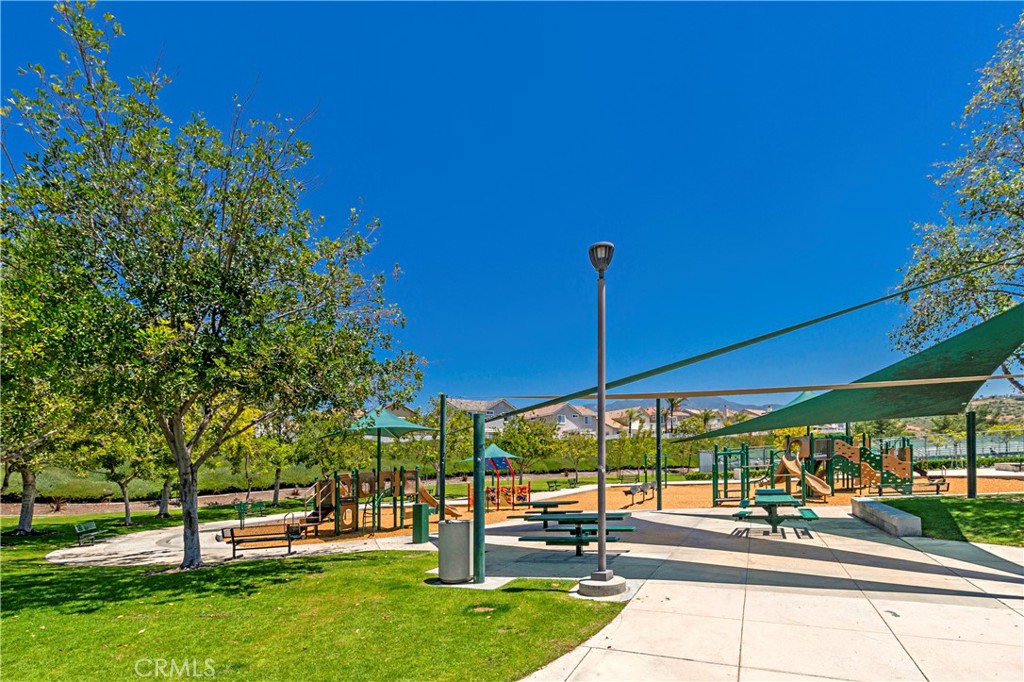 22 Sierra Blanco Lake Forest, CA 92610 - Photo 45 of 47 a view of a patio with a table and chairs under an umbrella