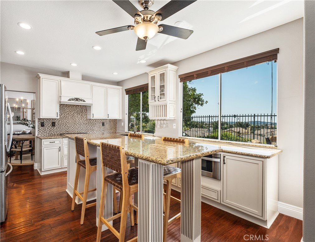 22 Sierra Blanco Lake Forest, CA 92610 - Photo 10 of 47 a kitchen with stainless steel appliances granite countertop a stove and a refrigerator
