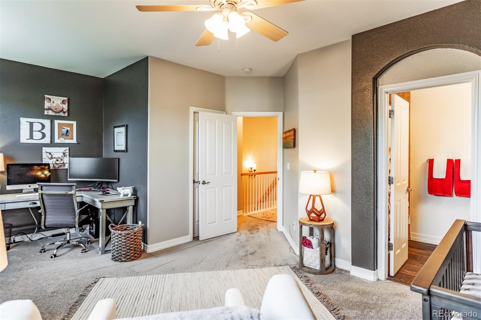 10162 RidgeGate Circle Lone Tree, CO 80124 - Photo 12 of 24 a view of a livingroom with workspace and a window
