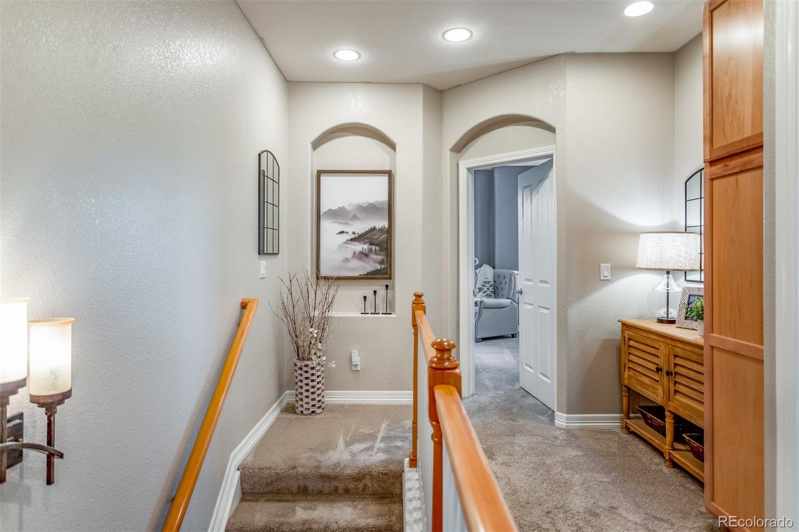 10162 RidgeGate Circle Lone Tree, CO 80124 - Photo 15 of 24 a view of a bedroom with furniture and staircase