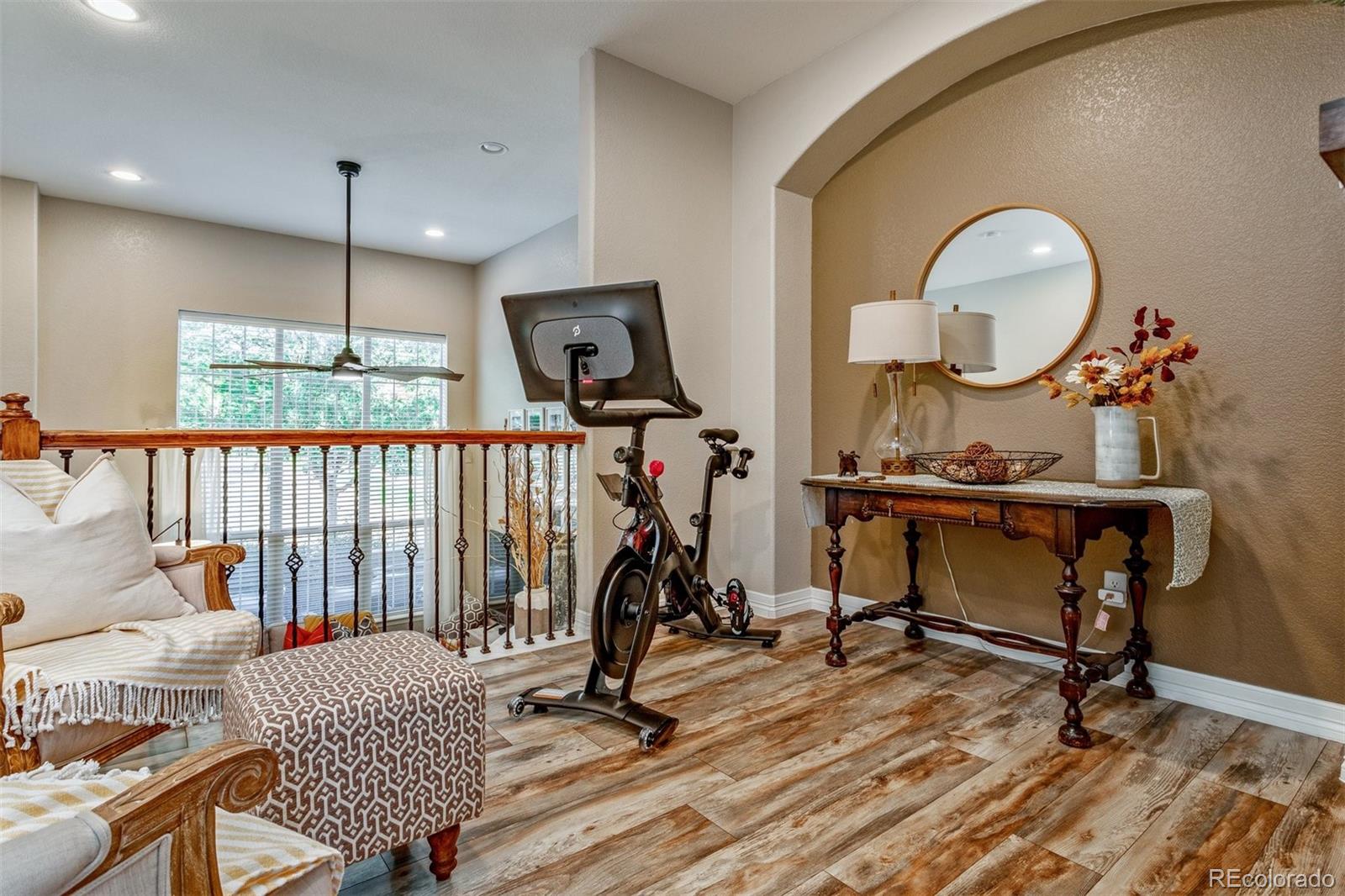 10162 RidgeGate Circle Lone Tree, CO 80124 - Photo 3 of 24 a view of a room with gym equipment