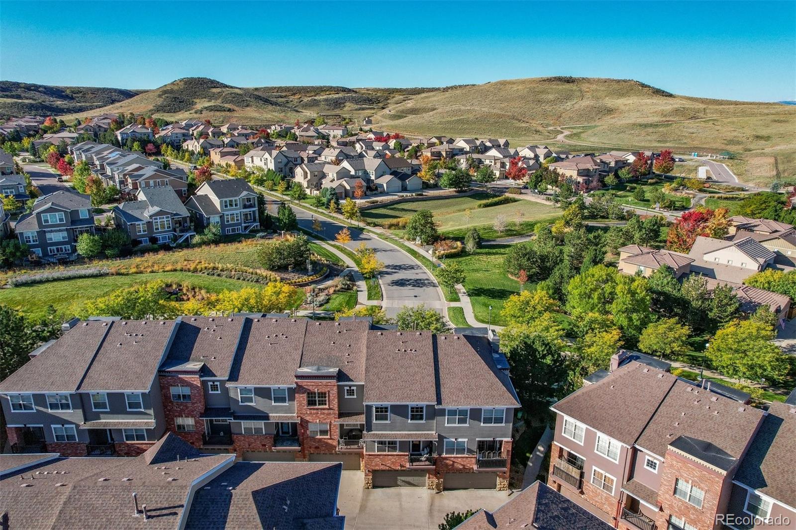 10162 RidgeGate Circle Lone Tree, CO 80124 - Photo 7 of 24 an aerial view of residential houses and outdoor space
