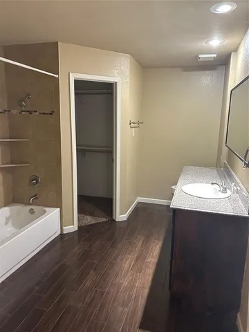 a bathroom with a sink and a bathtub