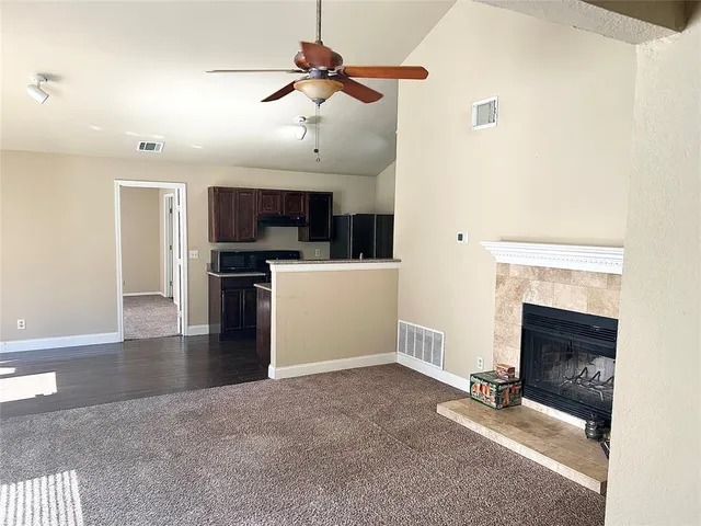 a view of a livingroom with furniture and a fireplace