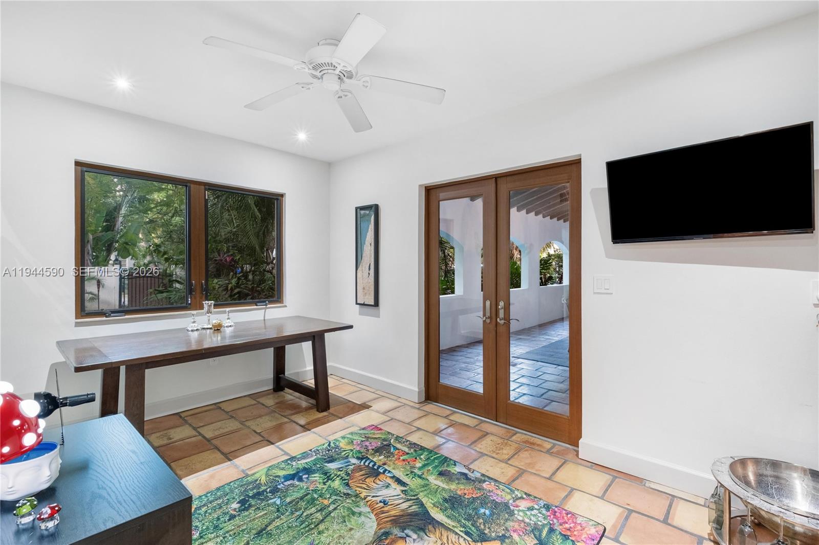 320 West 26th Street Miami Beach, FL 33140 - Photo 14 of 33 a view of a workspace with furniture and a window