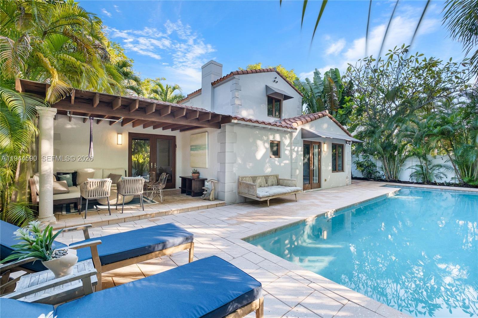 320 West 26th Street Miami Beach, FL 33140 - Photo 23 of 33 a view of a house with swimming pool and sitting area